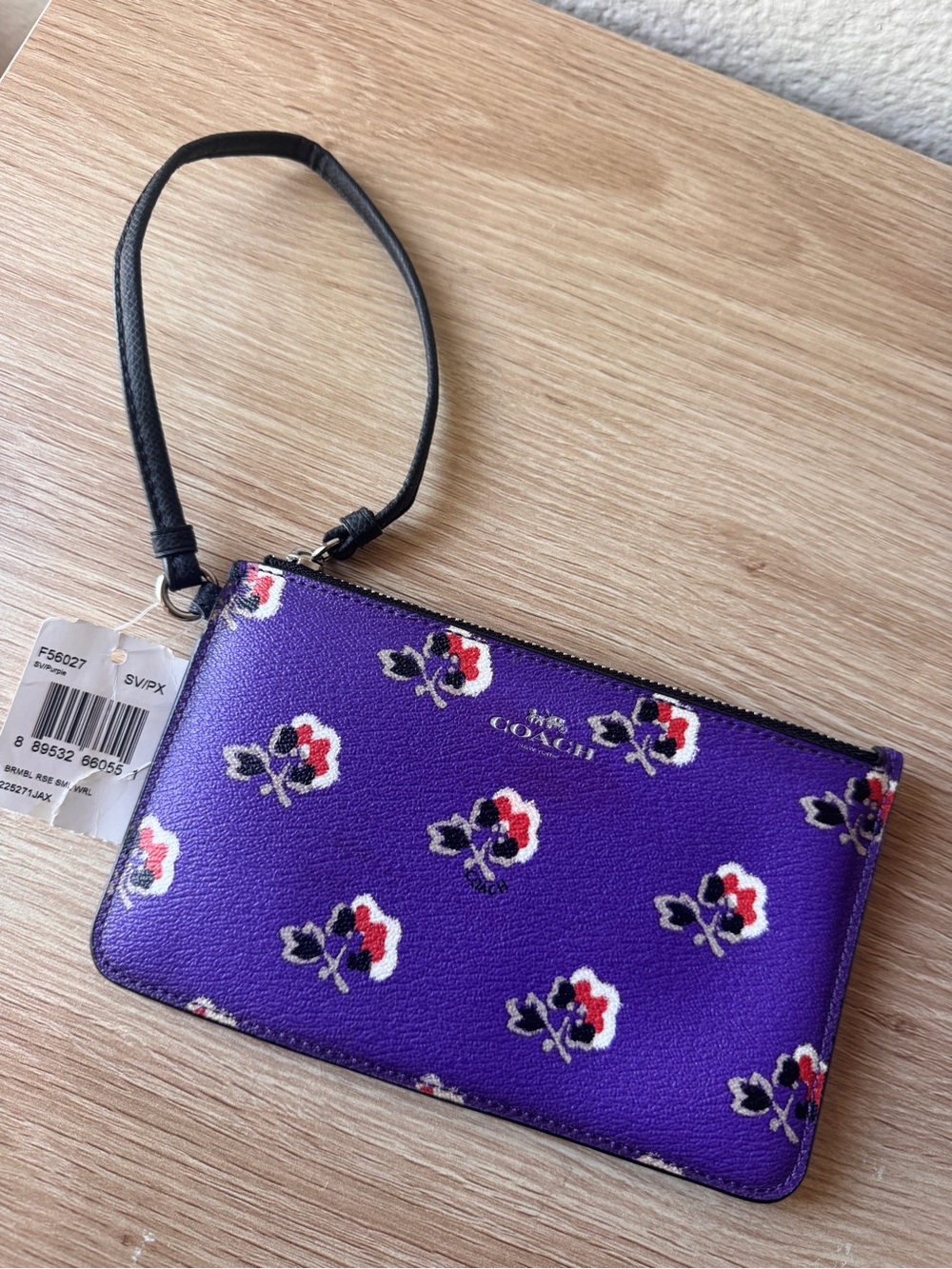 COACH Purple Floral Zip Wristlet with Black Strap